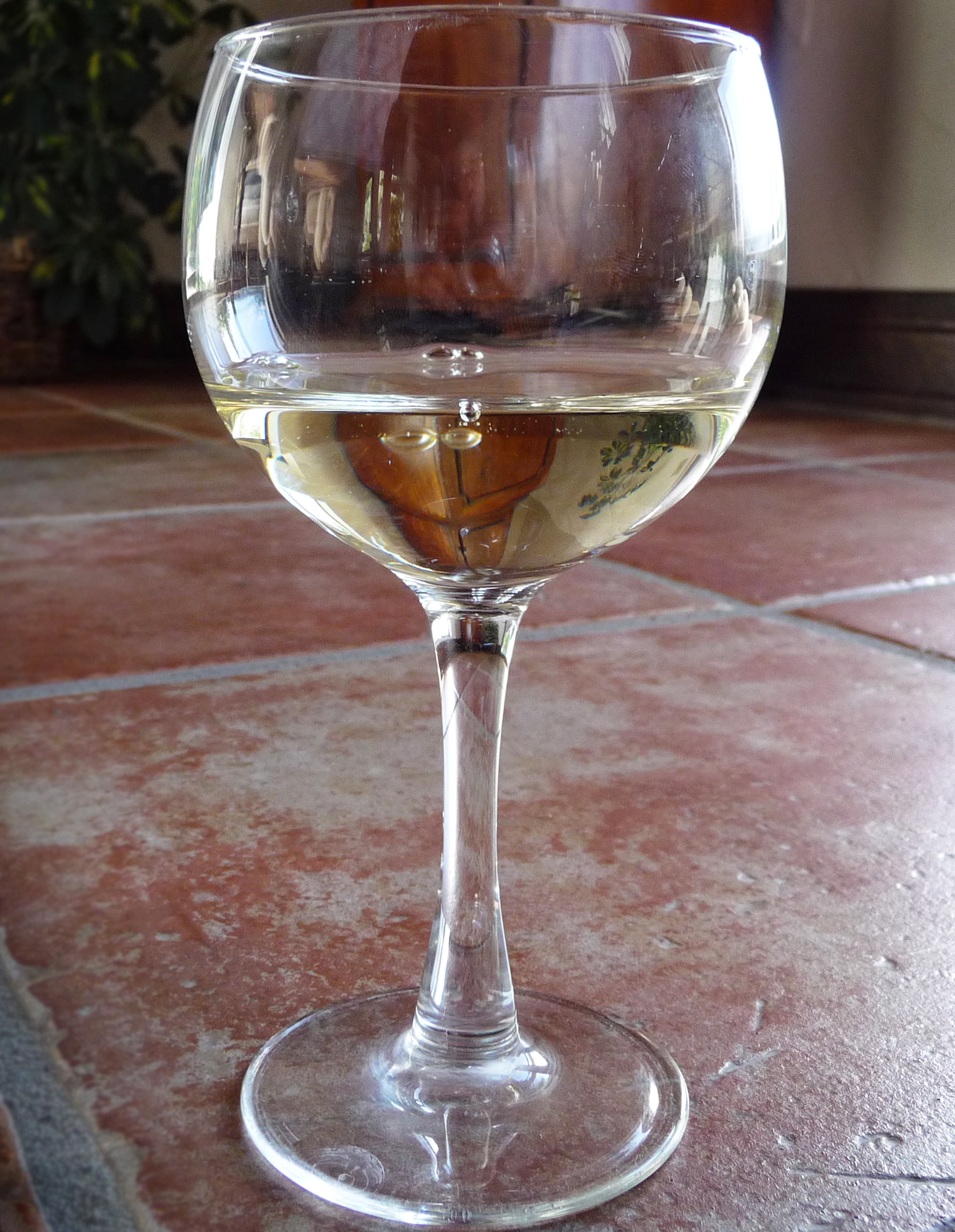 wineglass on tile floor