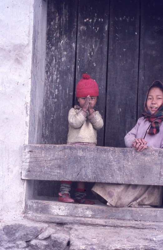 A Small Child Saying Namaste In The Hills Above Darjeeling