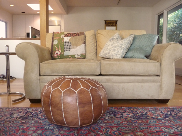 Pottery-Barn-Pearce-Loveseat-with-Moroccan-Pouf-and-Eileen-Gray-style-Table