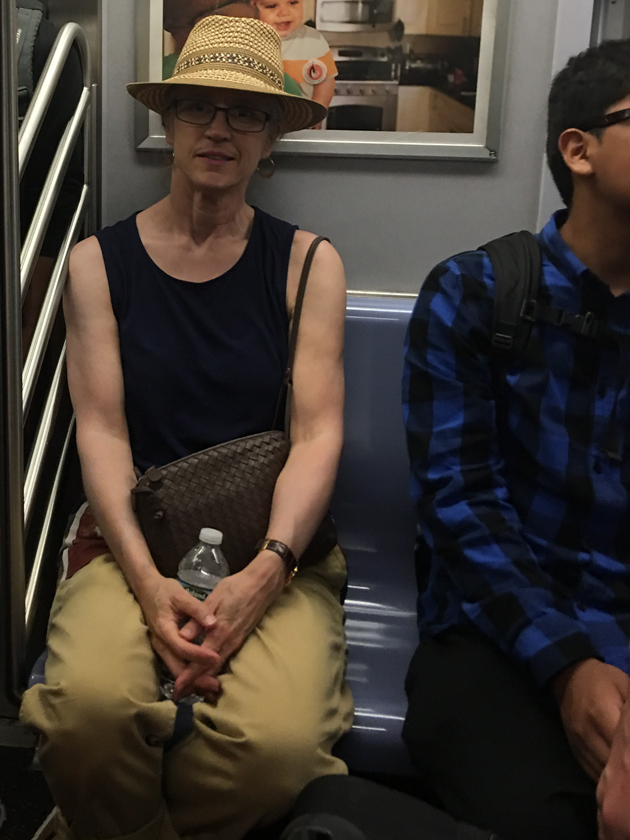 riding-the-subway-in-a-hat