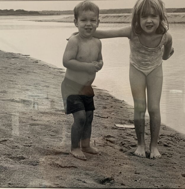 Two small children, obviously chilly, at a beach in Martha's Vineyard