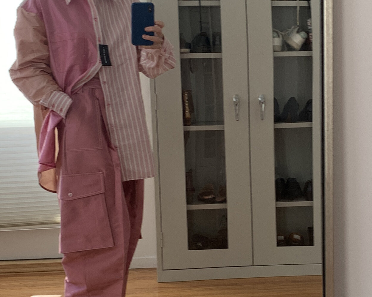 Christopher John Rogers pink silk satin cargo pants and striped shirt