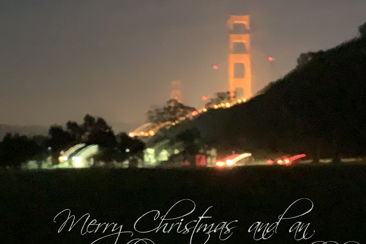 A nighttime photo of the Golden Gate Bride glowing red; the words Merry Christmas and an exceptionally Happy Hanukkah in type below